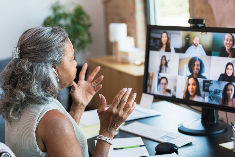 women attending meeting on laptop
