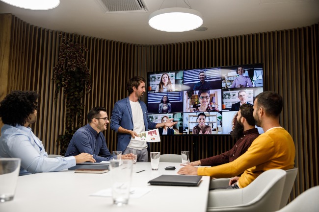 Team in Denver, CO participating in a virtual video conference meeting