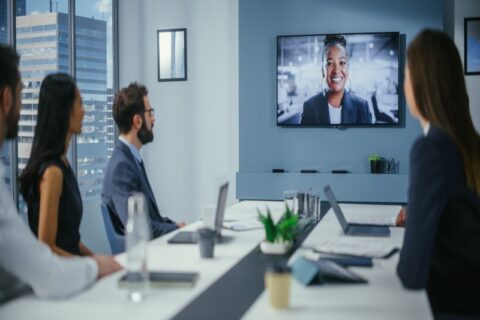 A team using live streaming best practices for conferences in Denver, CO, in a modern meeting room